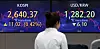 Screens in Hana Bank's trading room in central Seoul show stock and foreign exchange markets open on Tuesday. [YONHAP]
