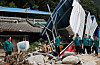 President Yoon Suk Yeol, in white sneakers, visits the site of a landslide in Yecheon County, North Gyeongsang on Monday upon his return from a weeklong trip to Europe. [YONHAP]