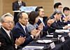 Finance Minister Choo Kyung-ho, second from left, participates in a meeting with heads of midsized businesses in Seoul on Monday. [YONHAP]