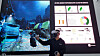 An on-site staff shows visitors how the cloud virtual reality (VR) game Alyx works, wearing a VR headgear, during a press tour of the Metaverse Playground on Monday in Coex, Southern Seoul. [YOON SO-YEON]