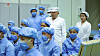 North Korean leader Kim Jong-un, center, inspects the country's first military reconnaissance satellite on Tuesday. [KOREAN CENTRAL NEWS AGENCY]