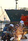 Shipbuilding companies are struggling to find a workforce despite securing a large number of orders. Pictured are employees working on ship construction at HD Hyundai Heavy Industries (HHI) in Ulsan. [HD HHI]