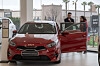 A customer shops at Kia Integral Car, a dealership in Barcelona, Spain. [KIA]