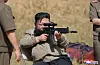 North Korean leader Kim Jong-un aims a weapon as he visits a special forces training base at an undisclosed location in North Korea on Sept. 11 in this photo that appeared in the state-run KCNA two days later. [YONHAP]