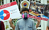 Workers participate in a press conference organized by the Korean Federation of Construction Industry Trade Unions (KFCITU) in front of the Central Government Complex in central Seoul, on Thursday. During the conference, the KFCITU requested that the government come up with some measures that can provide better working environments on construction sites, such as the shortening of working hours as a heat wave hits much of the country. [YONHAP]