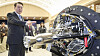 President Yoon Suk Yeol views a small launch vehicle built by a domestic start-up, Perigee Aerospace, ahead of a luncheon meeting with Korea’s space economy pioneers Tuesday at the Yongsan presidential office in central Seoul. [JOINT PRESS CORPS]