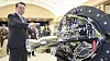 President Yoon Suk Yeol views a small launch vehicle built by a domestic start-up, Perigee Aerospace, ahead of a luncheon meeting with Korea’s space economy pioneers Tuesday at the Yongsan presidential office in central Seoul. [JOINT PRESS CORPS]
