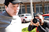Do Kwon being taken to court in handcuffs, to face charges of forging official documents, in Montenegro. [REUTERS/YONHAP]