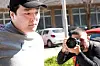Do Kwon being taken to court in handcuffs, to face charges of forging official documents, in Montenegro. [REUTERS/YONHAP]