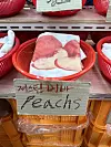 In round baskets are cardboard cutouts scribbled on with marker with fruit puns, like “Justin Bieber’s Peaches,” an ode to the pop singer’s hit 2021 song. [SHIN MIN-HEE]