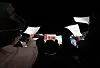 Protesters hold up blank sheets of paper and slogans during a protest at Hongdae, Mapo District, western Seoul on Wednesday night. [YONHAP]