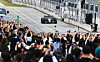 Spectators raise their smartphones to snap photos of a Mercedes-AMG Petronas Formula One car driven by Valtteri Bottas as it speeds around the track during the Peaches Run Universe 2025 event at Everland Speedway in Yongin, Gyeonggi, on Oct. 12. [YONHAP]