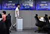 Screens in Hana Bank's trading room in central Seoul show stock and foreign exchange markets open on Friday. [YONHAP]