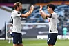 Son Heung-min of Tottenham Hotspur, right, celebrates with his teammates Harry Kane after scoring the opener during a Premier League match against Arsenal at Tottenham Hotspur Stadium on Sunday. [REUTERS/YONHAP]
