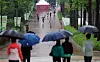 People holding their umbrellas walk through Children's Grand Park on Children's Day in eastern Seoul. [NEWS1]
