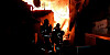 Firefighters try to extinguish a blaze that broke out in Guryong Village in southern Seoul, on Friday morning. [NEWS1]