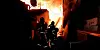 Firefighters try to extinguish a blaze that broke out in Guryong Village in southern Seoul, on Friday morning. [NEWS1]