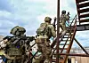 South Korean and U.S. Navy SEALs enter a building during a training exercise in a photo provided by the U.S. Indo-Pacific Command on Sunday. The U.S. Indo-Pacific Command said a West-Coast based SEAL team and the South Korean Naval Special Warfare Flotilla concluded a two-week exercise earlier this month. [YONHAP]