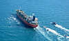 MT Hankuk Chemi, a South Korean-flagged oil tanker, is escorted by Islamic Revolutionary Guard vessels Monday to Iranian waters after being seized by Iranian authorities in the Strait of Hormuz in a photo released by the Tasnim News Agency. [AFP/YONHAP]