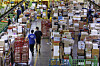 Workers sort parcels at the East Seoul Post and Logistics Center in Gwangjin District, eastern Seoul, on Tuesday, a week before the Chuseok harvest festival holiday. [YONHAP]