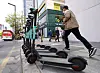 Kickgoings, one of the electric scooter brands operating in Korea, are parked on a roadside. [OLULO]