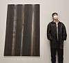 RM stands beside a painting by artist Yun Hyong-keun at PKM Gallery. [BTS OFFICIAL TWITTER]