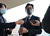 Justice Minister Han Dong-hoon, center, answers questions from the press in front of the ministry headquarters in Gwacheon, Gyeonggi, on Nov. 28. [YONHAP]