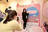 Visitors snap photos at photo op spots at the 2022 K-Beauty Brands Show at the Community House Masil in Myeong-dong, central Seoul, on Friday. [KOREA COSMETIC INDUSTRY INSTITUTE]
