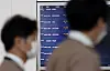 An electronic departure board at Incheon International Airport on Sunday shows Asiana Airlines' newly resumed flight to Nanjing in China. [YONHAP]