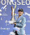 Park Hyun-kyung poses for a photo after winning the inaugural IS Dongseo Busan Open at Stone Gate Country Club in Gijang, Busan, on Monday. [YONHAP]