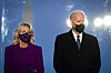 U.S. President-elect Joe Biden, right, and his wife Jill Biden, wear masks at the Lincoln Memorial Reflecting Pool during a Covid-19 memorial in Washington Tuesday on the eve of his inauguration Wednesday. [UPI/YONHAP]