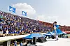 The captain of Yonsei’s iconic AKARAKA Cheering Squad performs in front of a crowd of Yonsei University students during a baseball game in 2015 against Korea University. [YONSEI UNIVERSITY]