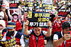 Protestors hold up placards demanding that Japan retract its decision to release radioactive water from the crippled Fukushima nuclear power plant at a rally in Jung District, central Seoul, on Saturday. [YONHAP]