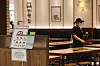 A restaurant in a shopping mall in Yeongdeungpo District, western Seoul, sits empty Sunday as central health authorities announced the social distancing level of the greater Seoul area would be raised to Level 2.5. [YONHAP]