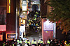 Police and firefighters look over the alleyway next to the Hamilton Hotel, the site of the Itaewon crowd crush that killed more than 150 people in 2022. [NEWS1]