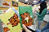 Greeting cards featuring tiger characters are on sale at a Muzik Tiger pop-up store at Homeplus’ Mapo branch in western Seoul on Monday. Tiger-themed products are on sale at a number of stores as the retail industry marks the start of the year of the tiger. [YONHAP]