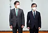 President Moon Jae-in, left, poses with the new Minister of Land, Infrastructure and Transport, Byeon Chang-heum, at the Blue House on Tuesday. Byeon is the 26th cabinet member under President Moon to have been approved without the consent of the opposing party. [YONHAP]