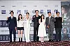 From left, actors Kim Do-yoon, Park Ji-hoo, Kim Sun-young, Park Seo-jun, Park Bo-young, Lee Byung-hun and director Um Tae-hwa pose for a photo during a screening and press conference for 'Concrete Utopia' at Lotte Cinema World Tower branch in Songpa Distirct, southern Seoul, on Monday. [LOTTE ENTERTAINMENT]
