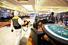 An employee disinfects poker tables inside state-run casino Kangwon Land in Gangwon province on Wednesday. The casino, the only one in the country where Koreans are legally allowed to gamble, will soon reopen after closing on Feb. 23. [NEWS1]