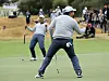 An Byeong-hun celebrates holing a birdie putt on the 17th hole in his match with Adam Scott against Tony Finau and Matt Kuchar of the United States during the afternoon four-ball matches in the 2019 Presidents Cup at Royal Melbourne Golf Club in Melbourne on Dec. 14, 2019. [GETTY IMAGES]