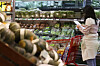 A person shops for groceries at a discount mart in Seoul on Sept. 23. [YONHAP]
