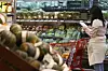 A person shops for groceries at a discount mart in Seoul on Sept. 23. [YONHAP]