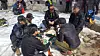 A group of hikers are drinking makeolli near the Daedongmun Gate at Mt. Bukhansan in March 2018. [KOREA NATIONAL PARK]