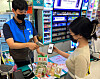 A model picks up products she bought from the Danggeun Market app at a GS25 store. [GS RETAIL]