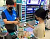 A model picks up products she bought from the Danggeun Market app at a GS25 store. [GS RETAIL]