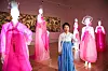 Hanbok designer Kim Hye-soon poses next to mannequins lit up with LED lights and wearing her hanbok at Kim Byung Jong Art Museum in Namwon, North Jeolla. [JANG JUNG-PIL]