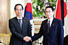 Prime Minister Han Duck-soo, left, shakes hands with Japanese Prime Minister Fumio Kishida during a meeting at the Akasaka Palace, a Japanese state guest house in Tokyo, on Wednesday. [NEWS1]