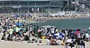 Tourists and locals cool off at Haeundae Beach in Busan on Sunday. As summer is coming, local governments announced plans to fully open beaches in July. Until then, some of the most popular beaches, like Haeundae Beach, will limit the number of people when they partially open this Tuesday. [SONG BONG-GEUN]
