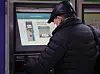A senior citizen waits to receive a metro pass for the elderly from a kiosk in Jongno Station, central Seoul, on Wednesday. [NEWS1]
