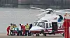 Democratic Party leader Lee Jae-myung disembarked from the helicopter that arrived from Busan upon landing at the pad on Nodeul Island in Yongsan, Seoul, on Tuesday. Lee was transferred to the Seoul National University Hospital after he was attacked. [YONHAP]